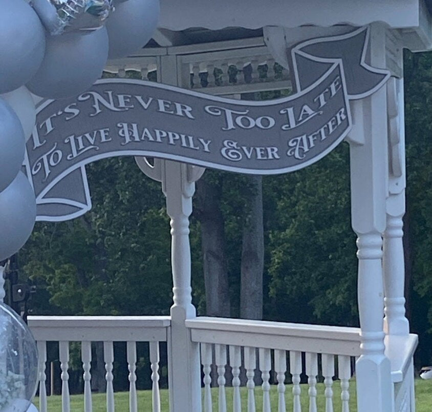 Custom Carved Wedding Banner Sign hanging in a gazebo